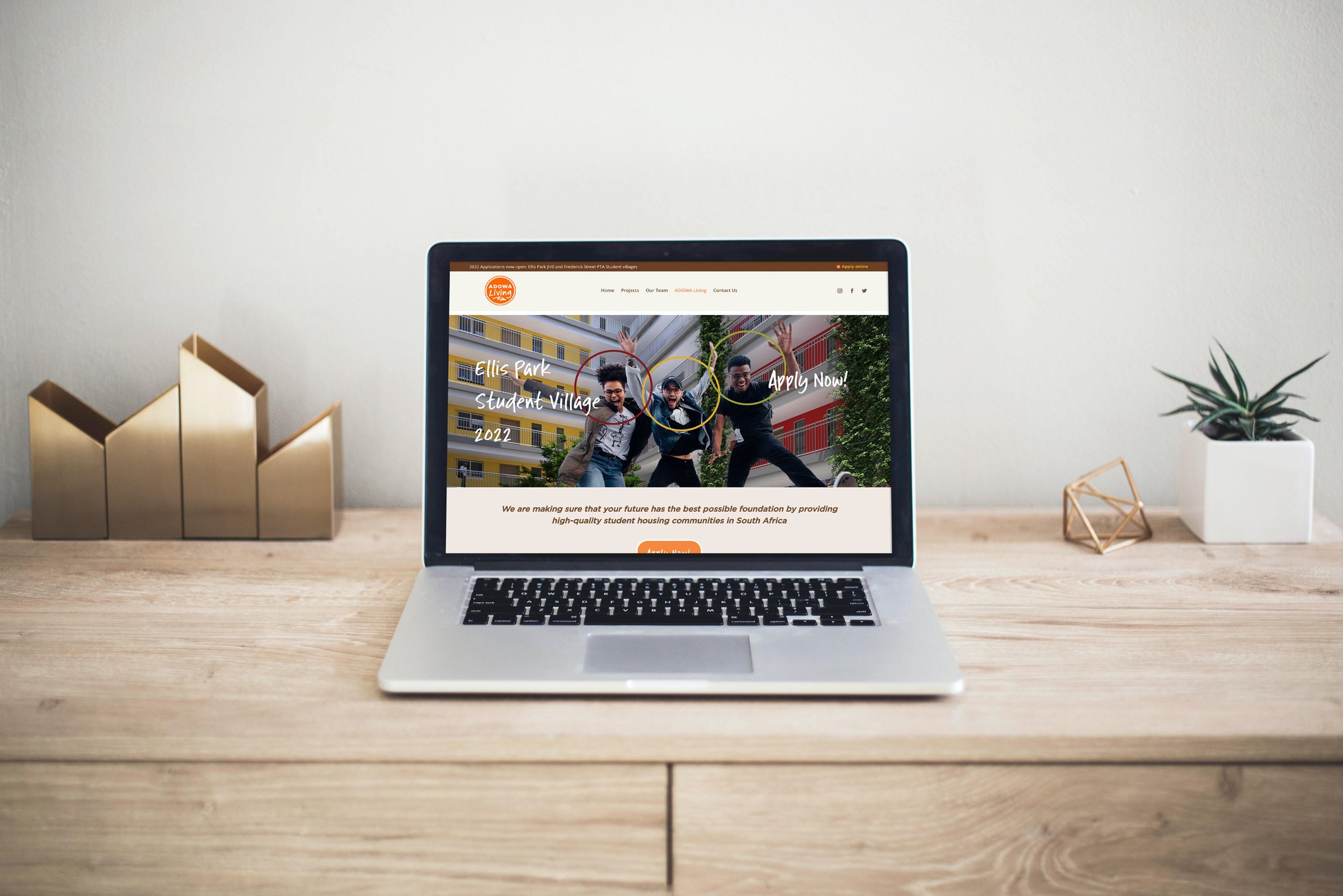 The ADOWA website shown on a laptop